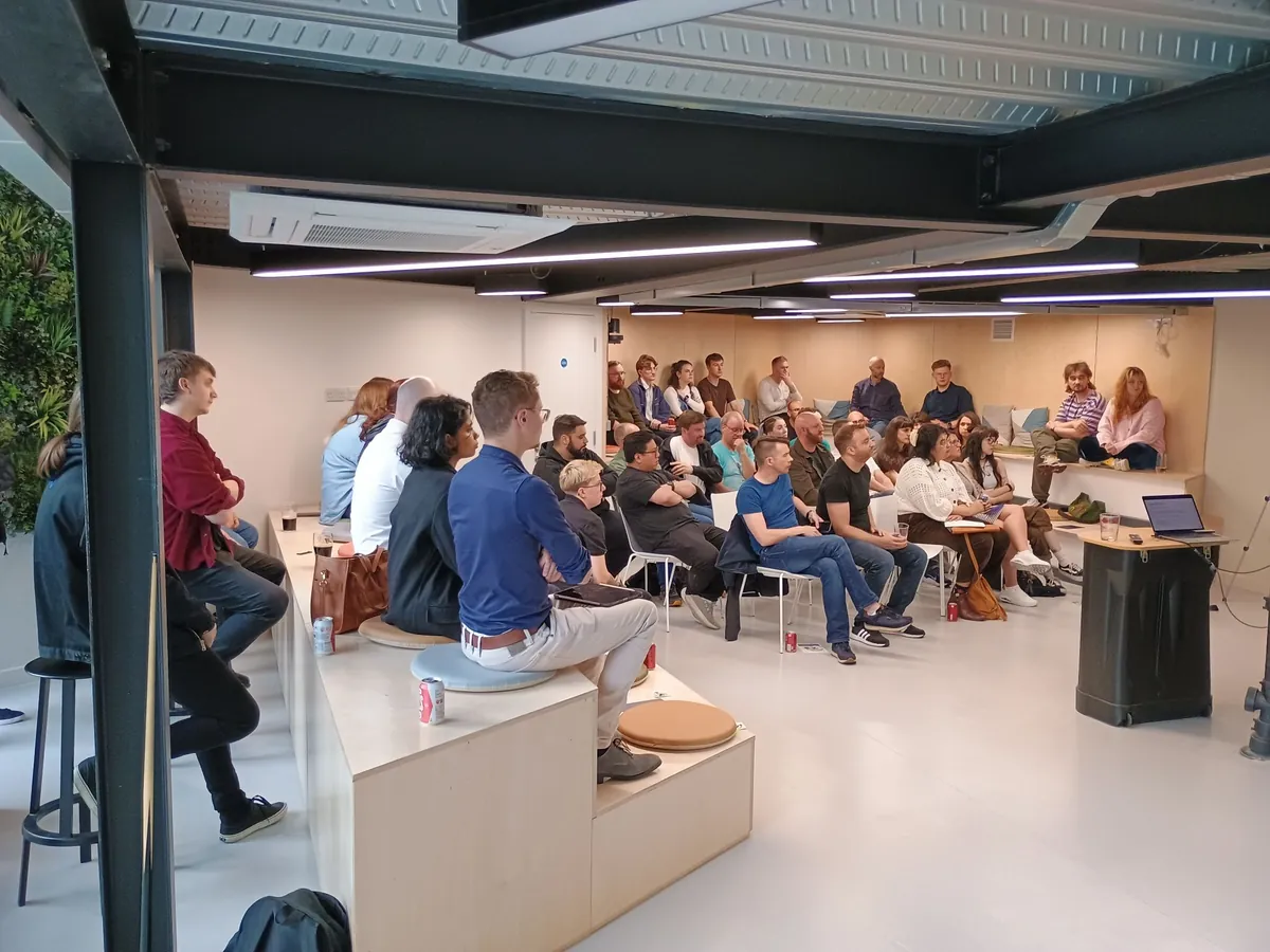 A full-house TSN audience listening to a talk
